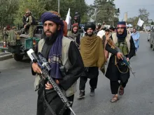 Taliban fighters gather along a street during a rally in Kabul on August 31, 2021 as they celebrate after the U.S. pulled all its troops out of the country to end a brutal 20-year war.